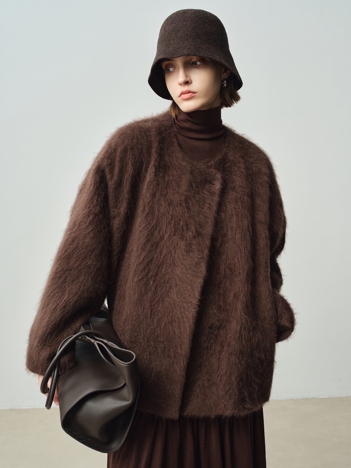 Wind wool coat women's autumn and winter long hair design sense round neck 058